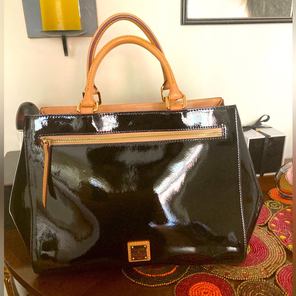 Dooney and Bourke black patent leather satchel in new condition